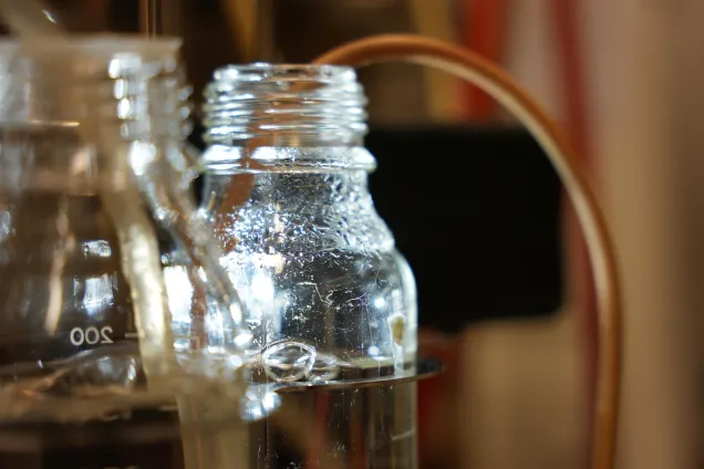 Glass bottles with tubes in a lab. Photo.