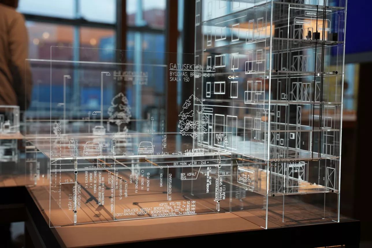 Plexiglas model of building with modern waste water system. Photo.